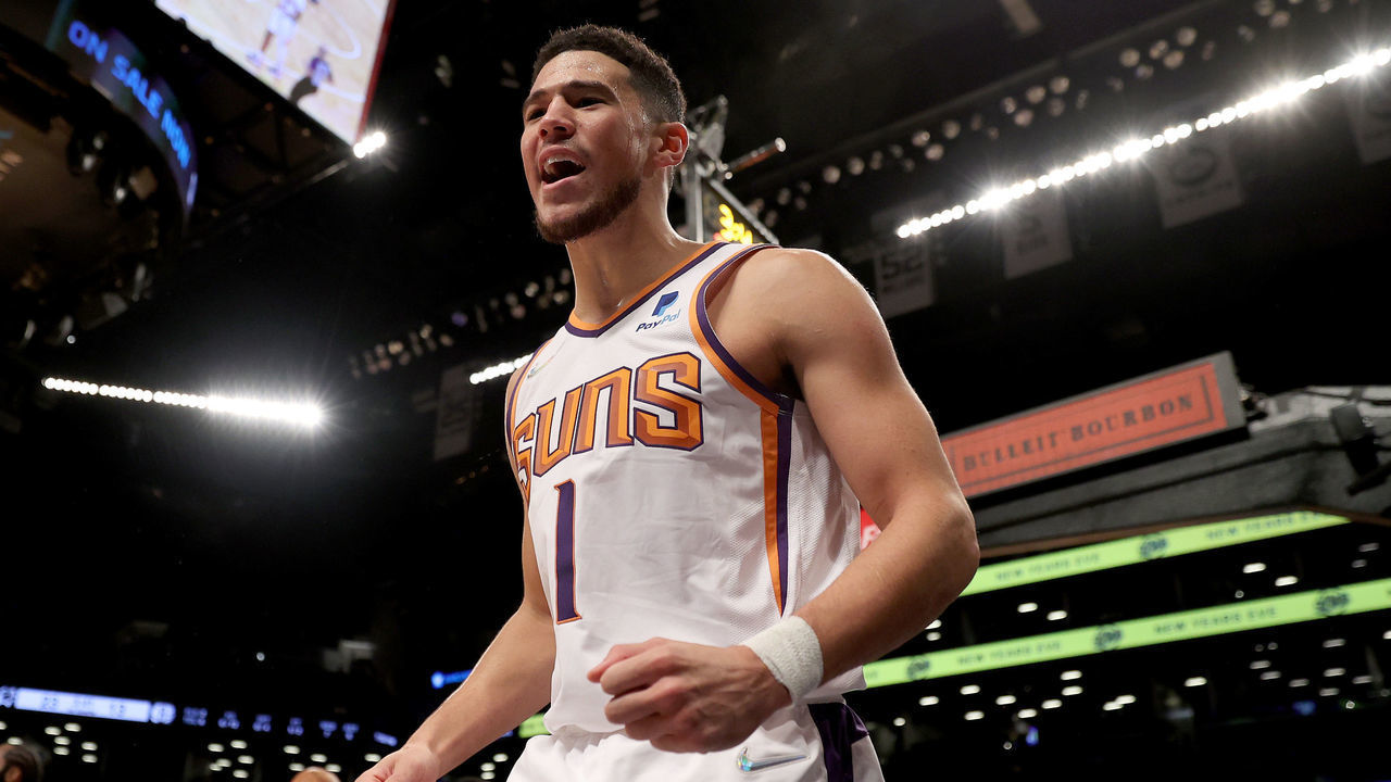 NEW YORK, NEW YORK - NOVEMBER 27: Devin Booker #1 of the Phoenix Suns celebrates after he drew the foul against the Brooklyn Nets at Barclays Center on November 27, 2021 in New York City.