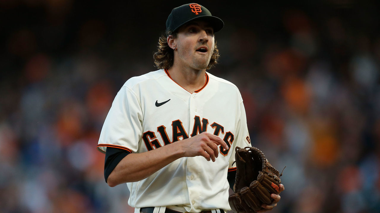 SAN FRANCISCO, CA - OCTOBER 09: Pitcher Kevin Gausman #34 of the San Francisco Giants walks to the dugout between innings during Game 2 of the NLDS between the Los Angeles Dodgers and the San Francisco Giants at Oracle Park on Saturday, October 9, 2021 in San Francisco, California.