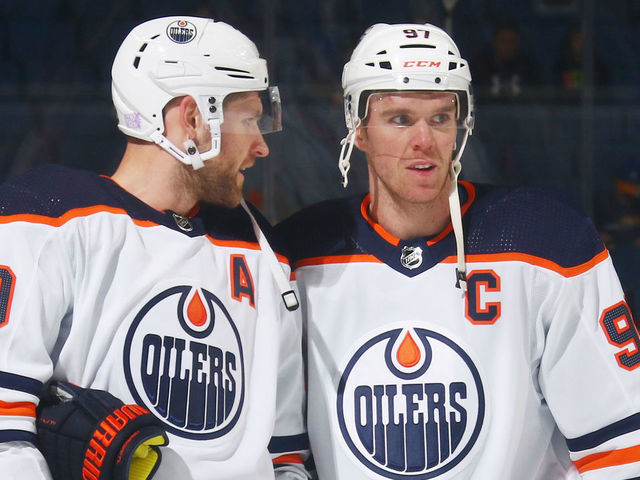 BUFFALO, NY - NOVEMBER 12: Leon Draisaitl #29 and Connor McDavid #97 of the Edmonton Oilers warmup prior to an NHL game against the Buffalo Sabres on November 12, 2021 at KeyBank Center in Buffalo, New York.