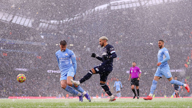 MANCHESTER, ENGLAND - NOVEMBER 28: Said Benrahma of West Ham United crosses the ball as snow falls during the Premier League match between Manchester City and West Ham United at Etihad Stadium on November 28, 2021 in Manchester, England.