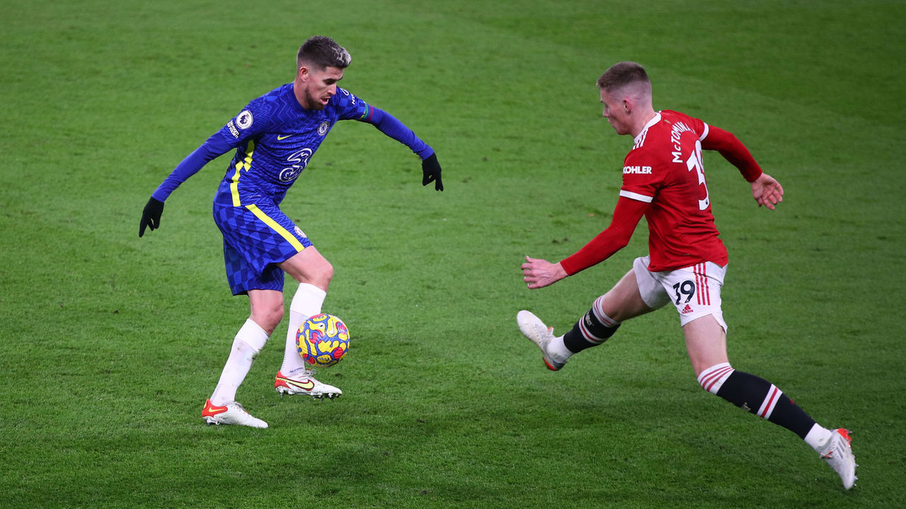 LONDON, ENGLAND - NOVEMBER 28: Jorginho of Chelsea controls the ball whilst under pressure from Scott McTominay of Manchester United during the Premier League match between Chelsea and Manchester United at Stamford Bridge on November 28, 2021 in London, England.