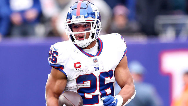 EAST RUTHERFORD, NEW JERSEY - NOVEMBER 28: Saquon Barkley #26 of the New York Giants runs with the ball against the Philadelphia Eagles in the second quarter at MetLife Stadium on November 28, 2021 in East Rutherford, New Jersey.