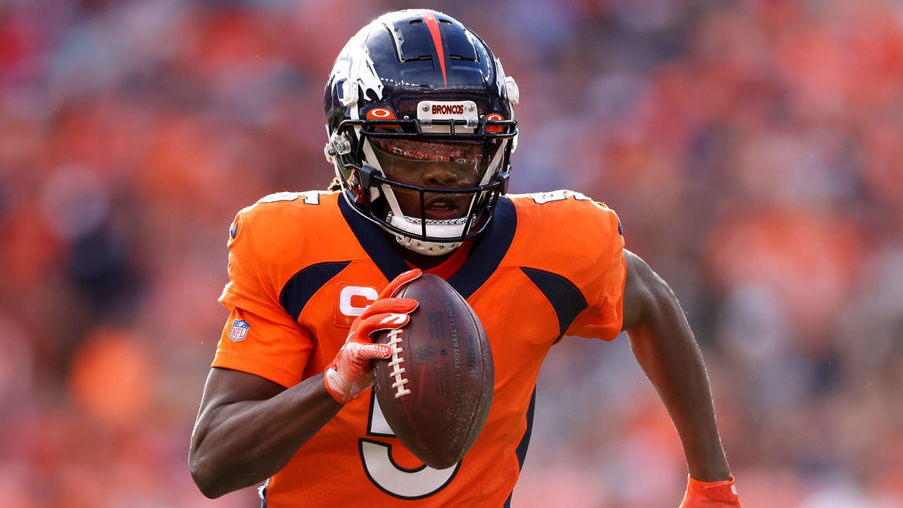 DENVER, COLORADO - NOVEMBER 28: Teddy Bridgewater #5 of the Denver Broncos carries the ball for a touchdown in the first quarter of the game against the Los Angeles Chargers at Empower Field At Mile High on November 28, 2021 in Denver, Colorado.