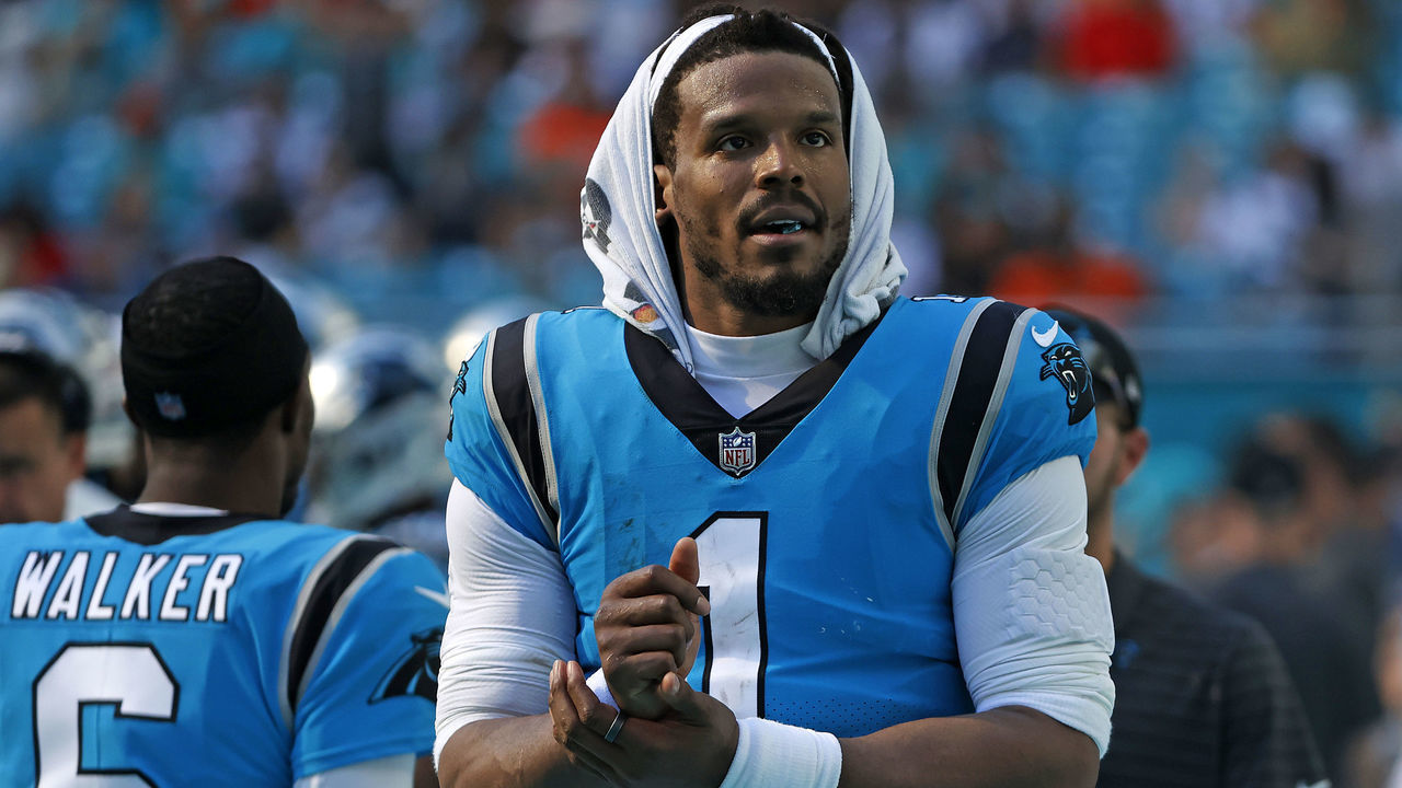 MIAMI GARDENS, FLORIDA - NOVEMBER 28: Cam Newton #1 of the Carolina Panthers looks on from the sideline during the first half against the Miami Dolphins at Hard Rock Stadium on November 28, 2021 in Miami Gardens, Florida.