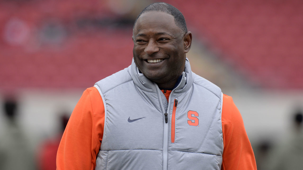 LOUISVILLE, KY - NOVEMBER 13: Syracuse Orange head coach Dino Babers smiles as players warm up before the start of the college football game between the Syracuse Orange and the Louisville Cardinals on November 13, 2021, at Cardinal Stadium in Louisville, Kentucky.