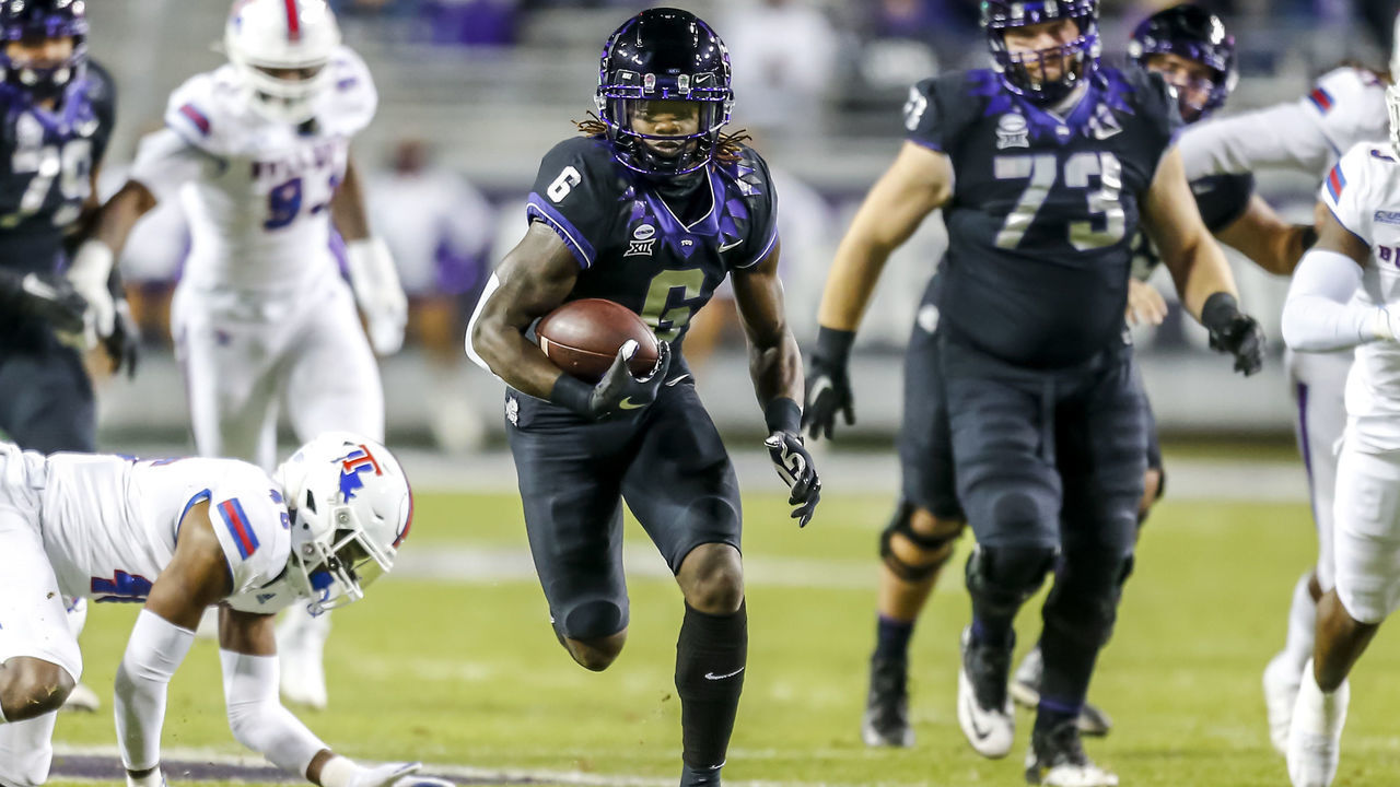 FORT WORTH, TX - DECEMBER 12: TCU Horned Frogs running back Zach Evans (6) runs through the line of scrimmage during the game between the TCU Horned Frogs and the Louisiana Tech Bulldogs on December 12, 2020 at Amon G. Carter Stadium in Fort Worth, Texas.