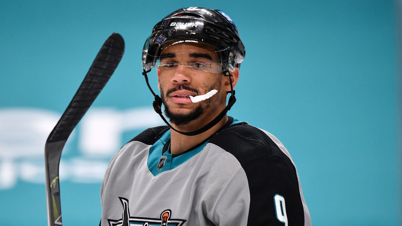 SAN JOSE, CA - MARCH 19: Evander Kane #9 of the San Jose Sharks looks down at the ice after the play against the St. Louis Blues at SAP Center on March 19, 2021 in San Jose, California.