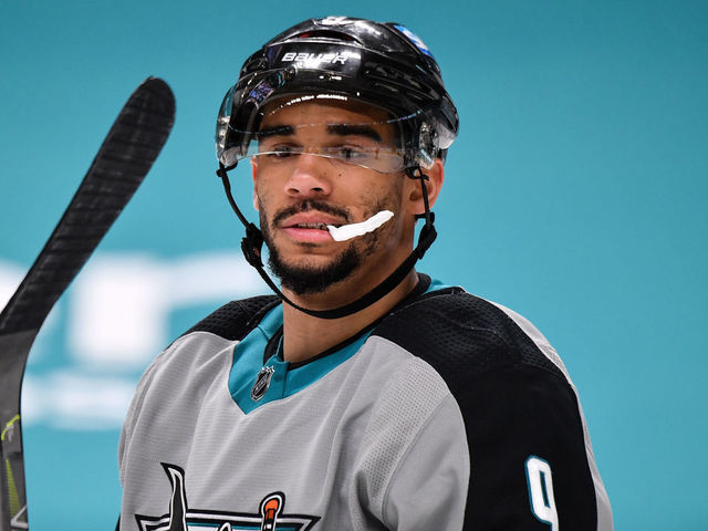 SAN JOSE, CA - MARCH 19: Evander Kane #9 of the San Jose Sharks looks down at the ice after the play against the St. Louis Blues at SAP Center on March 19, 2021 in San Jose, California.