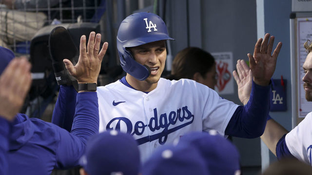Los Angeles, CA - October 12: Los Angeles Dodgers' Corey Seager celebrates with the dugout after scoring on a double by Trea Turner during the first inning in game four of the 2021 National League Division Series against the San Francisco Giants at Dodger Stadium on Tuesday, Oct. 12, 2021 in Los Angeles, CA. (Robert Gauthier / Los Angeles Times via Getty Images)