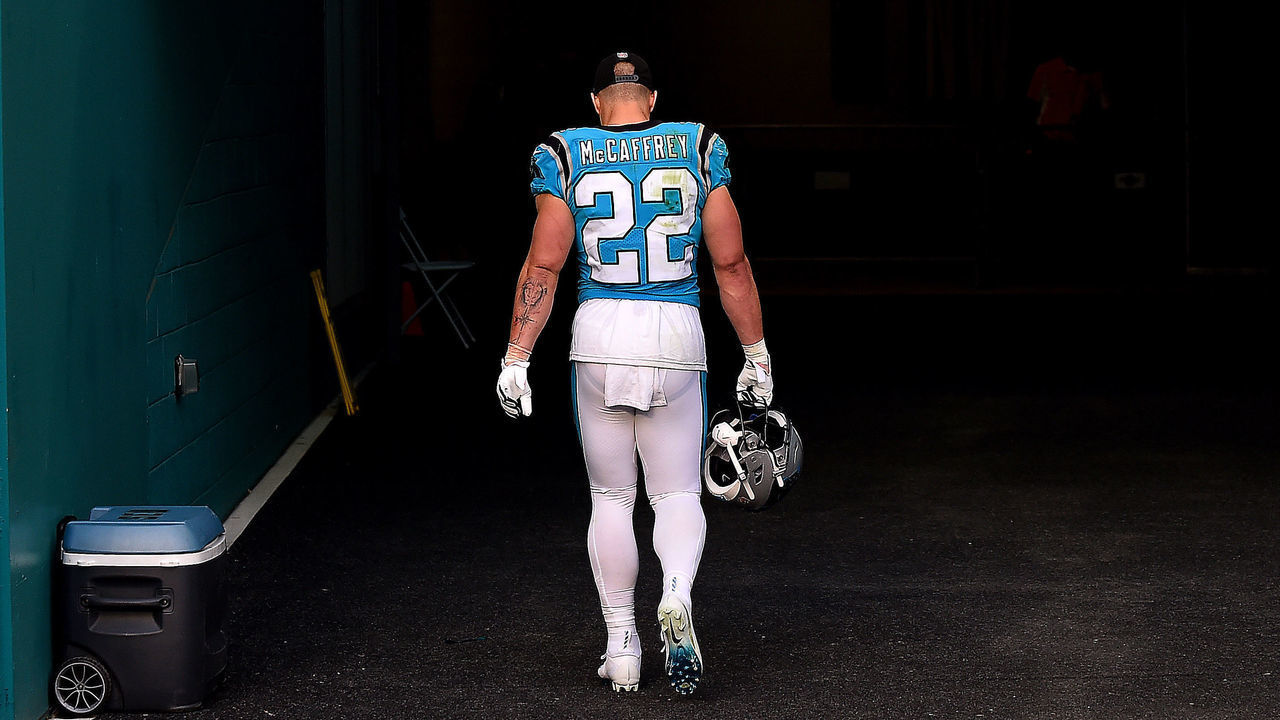 MIAMI GARDENS, FLORIDA - NOVEMBER 28: Christian McCaffrey #22 of the Carolina Panthers walks back to the locker room after Carolina was defeated by Miami 33-10 at Hard Rock Stadium on November 28, 2021 in Miami Gardens, Florida.