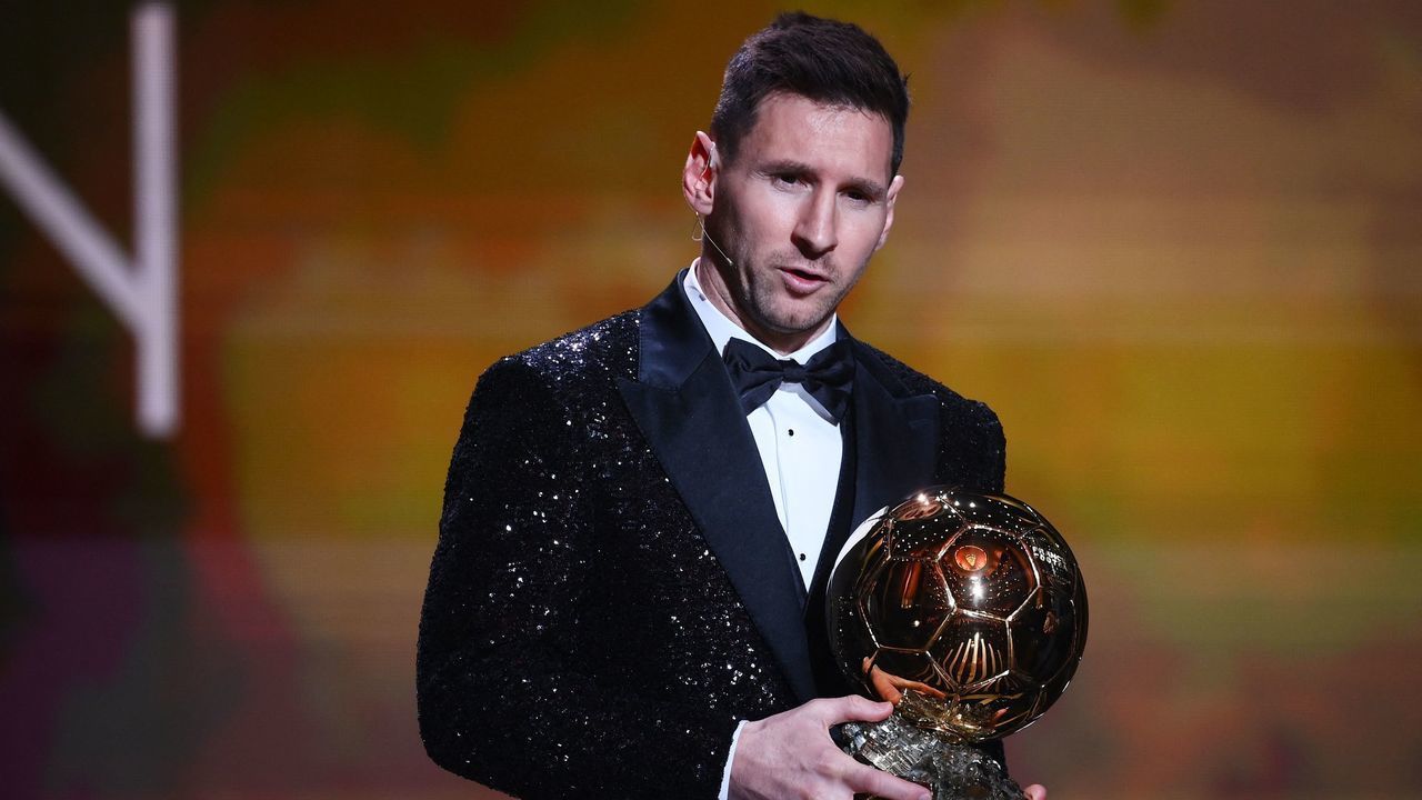 Paris Saint-Germain's Argentine forward Lionel Messi poses after being awarded the the Ballon d'Or award during the 2021 Ballon d'Or France Football award ceremony at the Theatre du Chatelet in Paris on November 29, 2021.