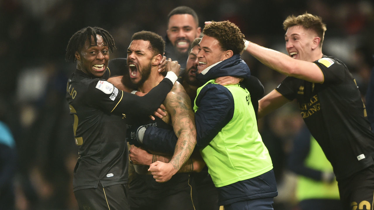 DERBY, ENGLAND - NOVEMBER 29: Andre Gray of Queens Park Rangers celebrates after he scores their second goal during the Sky Bet Championship match between Derby County and Queens Park Rangers at Pride Park Stadium on November 29, 2021 in Derby, England.