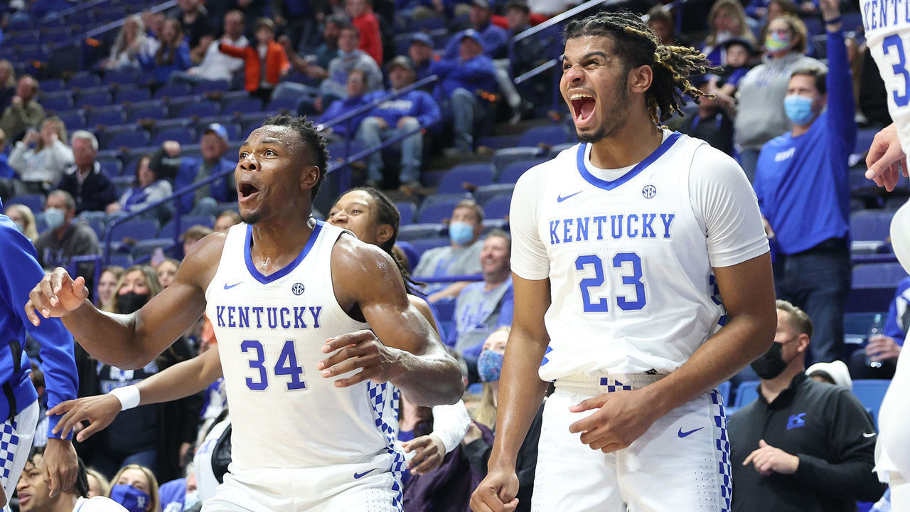 LEXINGTON, KENTUCKY - NOVEMBER 29: Oscar Tshiebwe #34 and Bryce Hopkins #23 of the Kentucky Wildcats celebrate in the game against the Central Michigan Chippewas at Rupp Arena on November 29, 2021 in Lexington, Kentucky.