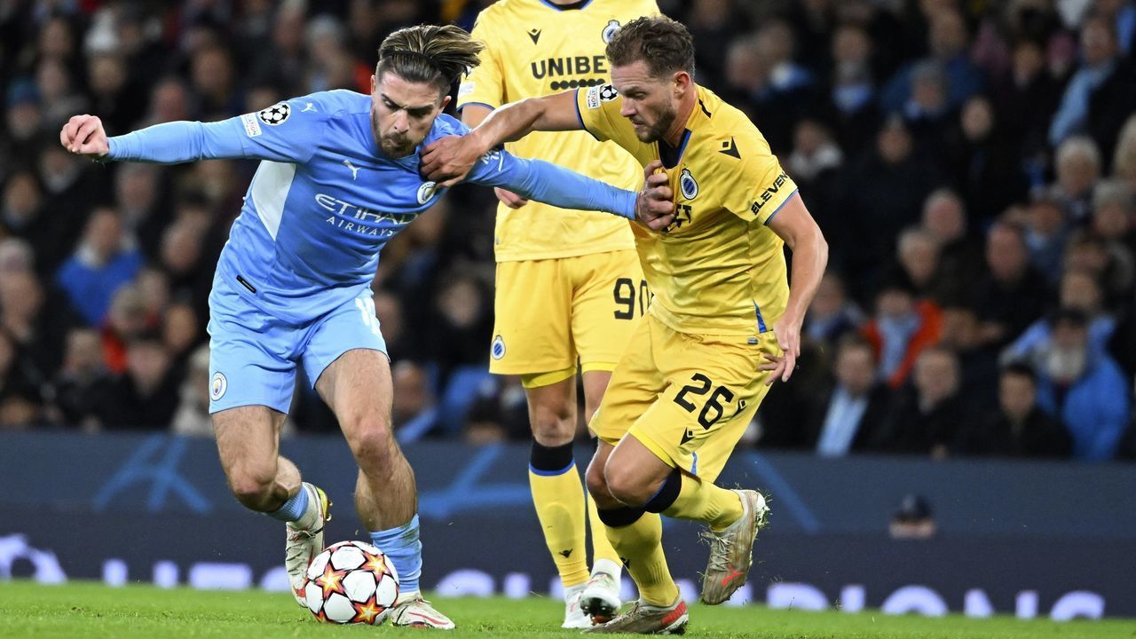 Manchester, United Kingdom - November 03 : Jack Grealish midfielder of Manchester City & Mats Rits midfielder of Club Brugge during the UEFA Champions League Group stage A match between Manchester City FC and Club Brugge on November 3, 2021 in Manchester, United Kingdom, 3/11/2021 ( Photo by Vincent Kalut / Photonews via Getty Images)