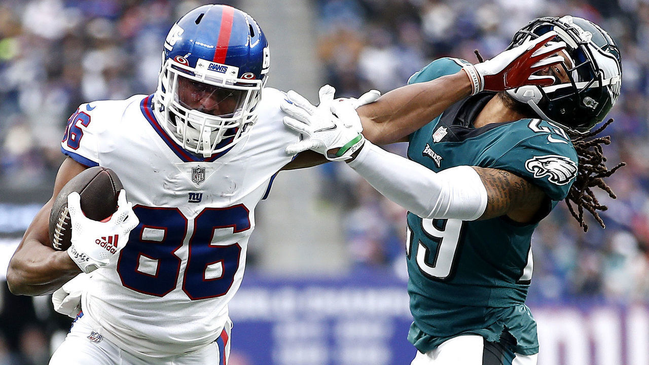EAST RUTHERFORD, NEW JERSEY - NOVEMBER 28: Darius Slayton #86 of the New York Giants fends off a tackle attempt by Avonte Maddox #29 of the Philadelphia Eagles in the third quarter at MetLife Stadium on November 28, 2021 in East Rutherford, New Jersey.