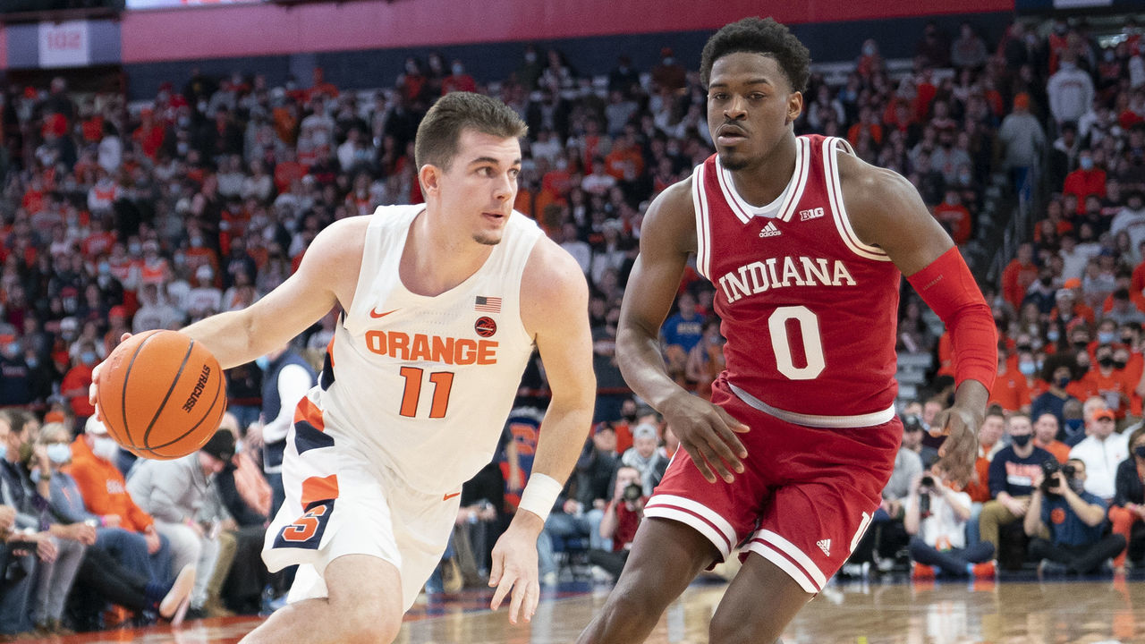 SYRACUSE, NY - NOVEMBER 30: Syracuse Orange Guard Joseph Girard III (11) dribbles the ball toward the basket with Indiana Hoosiers Guard Xavier Johnson (0) defending during the first half of the College Basketball game between the Indiana Hoosiers and Syracuse Orange on November 30, 2021, at the Carrier Dome in Syracuse, NY.