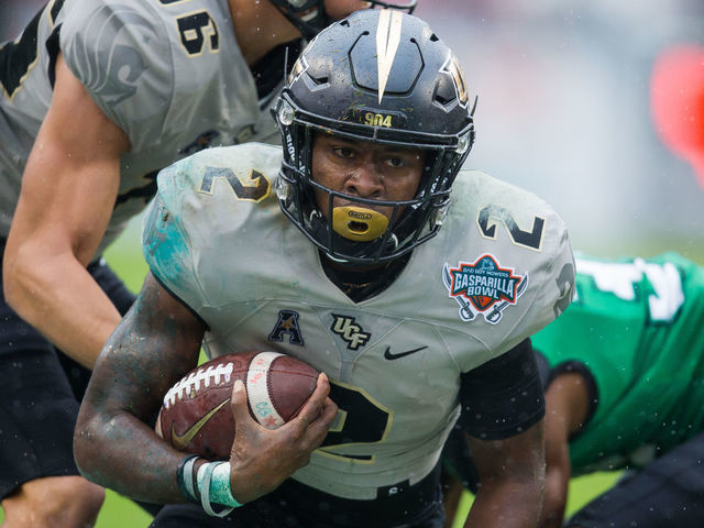 TAMPA, FL - DECEMBER 23: University of Central Florida running back Otis Anderson (2) runs during the Gasparilla Bowl between the University of Central Florida Knights and the Marshall Thundering Herd on December 23, 2019 at Raymond James Stadium in Tampa, FL.