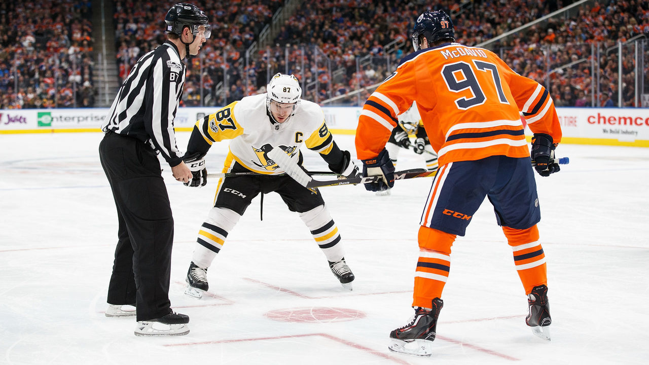 EDMONTON, AB - NOVEMBER 01: Connor McDavid #97 of the Edmonton Oilers faces off against Sidney Crosby #87 of the Pittsburgh Penguins at Rogers Place on November 1, 2017 in Edmonton, Canada.