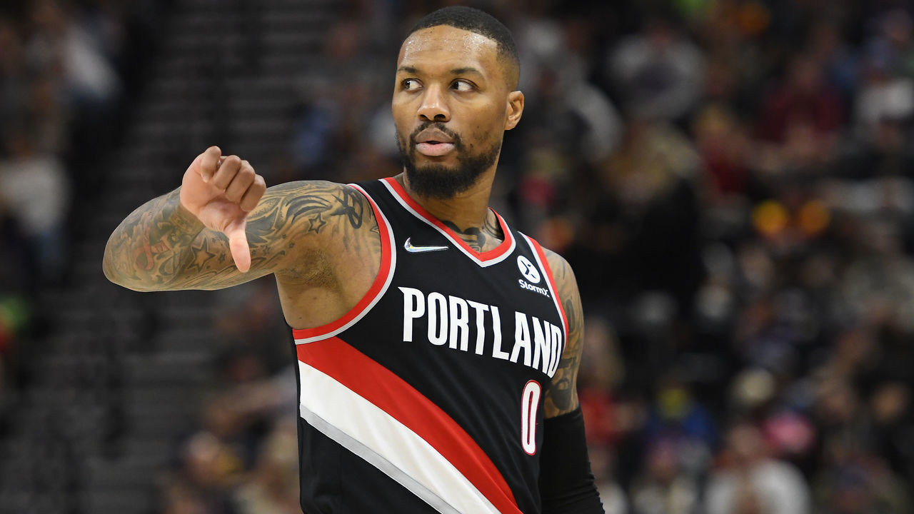 SALT LAKE CITY, UTAH - NOVEMBER 29: Damian Lillard #0 of the Portland Trail Blazers motions on the court in the second half during a game against the Utah Jazz at Vivint Smart Home Arena on November 29, 2021 in Salt Lake City, Utah.