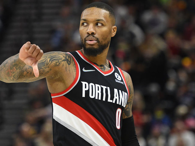 SALT LAKE CITY, UTAH - NOVEMBER 29: Damian Lillard #0 of the Portland Trail Blazers motions on the court in the second half during a game against the Utah Jazz at Vivint Smart Home Arena on November 29, 2021 in Salt Lake City, Utah.