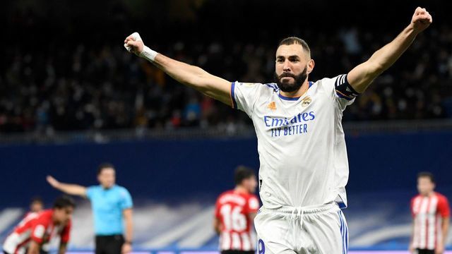 Real Madrid's French forward Karim Benzema celebrates after scoring his team's first goal during the Spanish league football match between Real Madrid CF and Athletic Club Bilbao at the Santiago Bernabeu stadium in Madrid on December 1, 2021.
