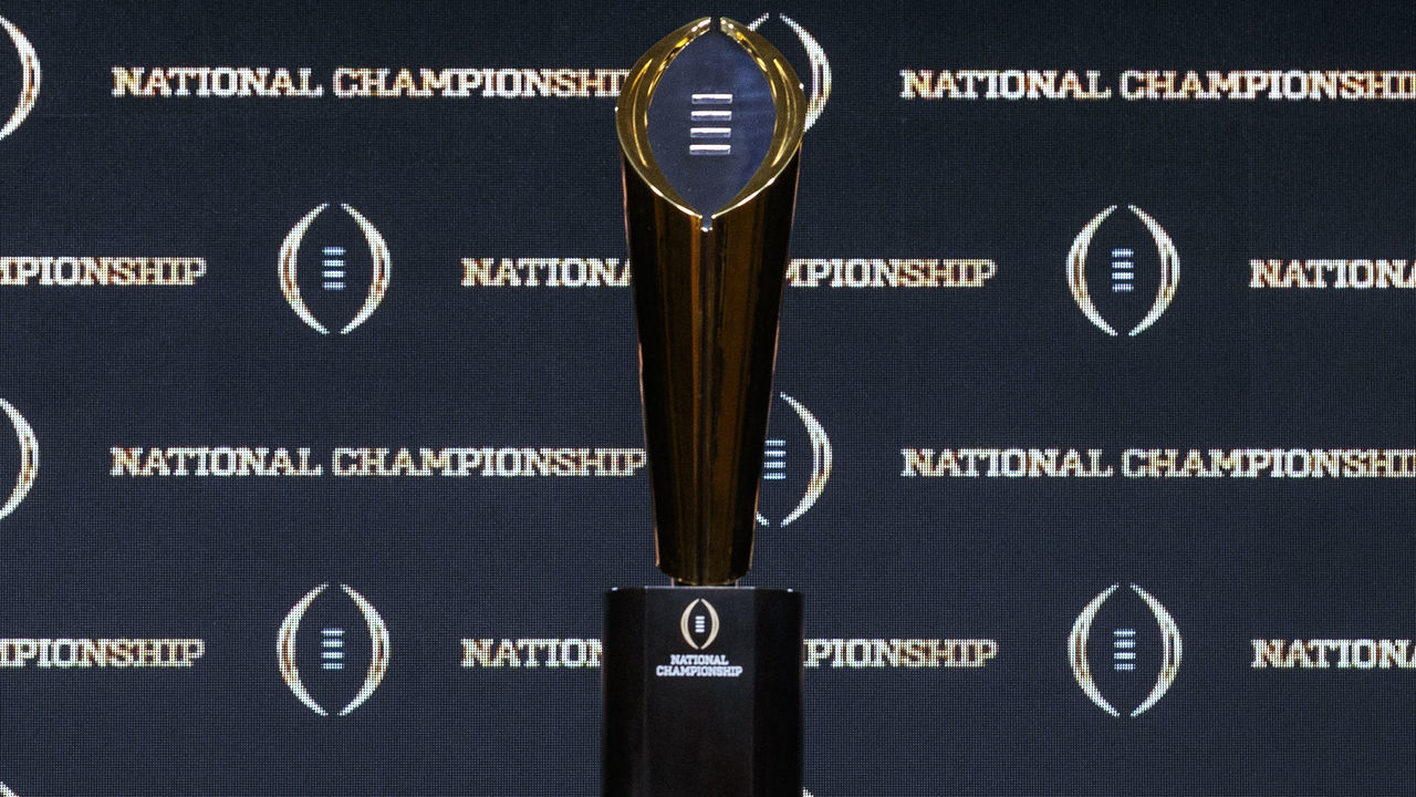 NEW ORLEANS, LOUISIANA - JANUARY 12: A general view of The College Football Playoff National Championship Trophy with both LSU Tigers and Clemson Tigers helmets on both sides before the start of the Head Coaches Press Conference before the College Football Playoff National Championship at the Grand Ballroom at the Sheraton Hotel on January 12, 2020 in New Orleans, Louisiana.