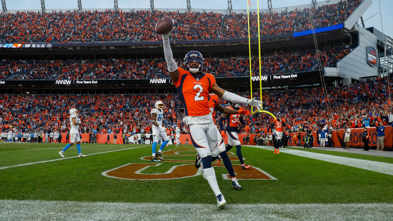 DENVER, CO - NOVEMBER 28: Cornerback Pat Surtain II #2 of the Denver Broncos celebrates his interception in the end zone during the second half against the Los Angeles Chargers at Empower Field at Mile High on November 28, 2021 in Denver, Colorado.
