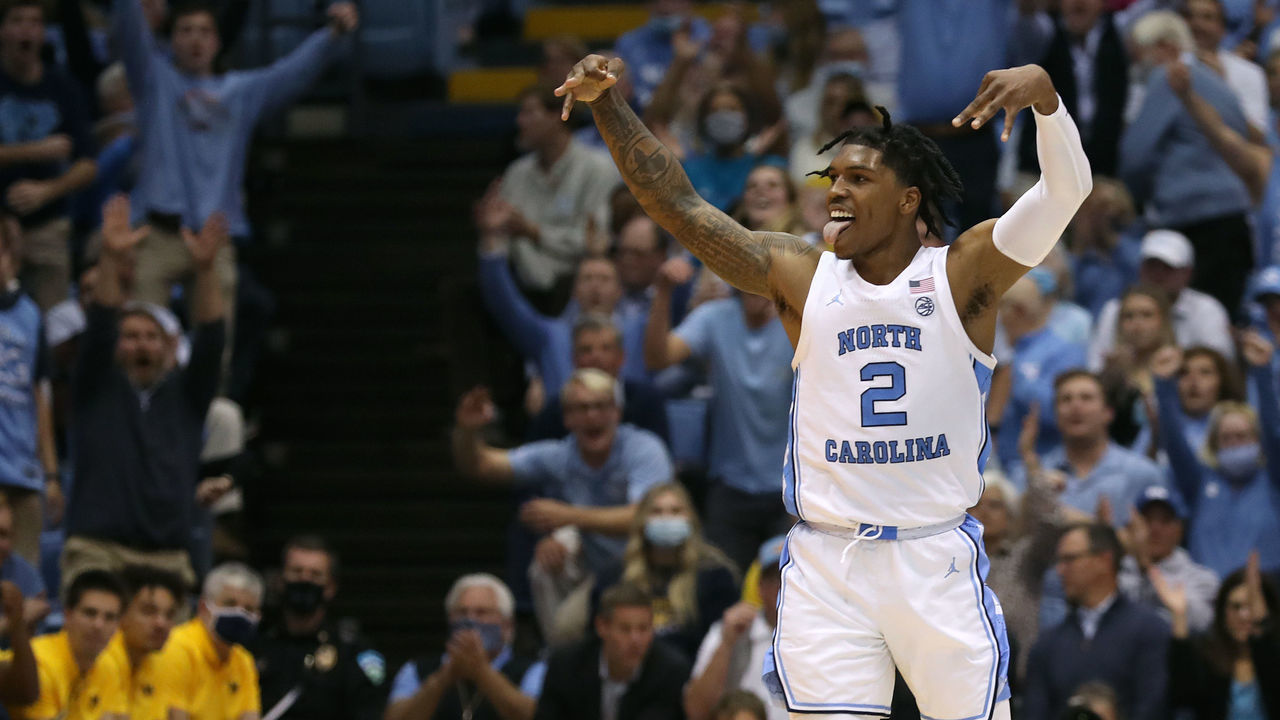 CHAPEL HILL, NORTH CAROLINA - DECEMBER 01: Caleb Love #2 of the North Carolina Tar Heels reacts after making a three-point basket against the Michigan Wolverines during the second half of their game at the Dean E. Smith Center on December 01, 2021 in Chapel Hill, North Carolina. The Tar Heels won 72-51.