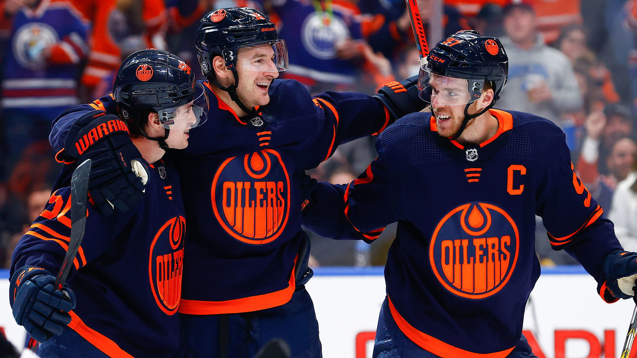 EDMONTON, AB - DECEMBER 1: Edmonton Oilers Center Connor McDavid (97) and Edmonton Oilers Left Wing Zach Hyman (18) celebrate a go ahead goal in front of Pittsburgh Penguins Center Sidney Crosby (87) in the third period during the Edmonton Oilers game versus the Pittsburg Penguins on December 1, 2021 at Rogers Place in Edmonton, AB.