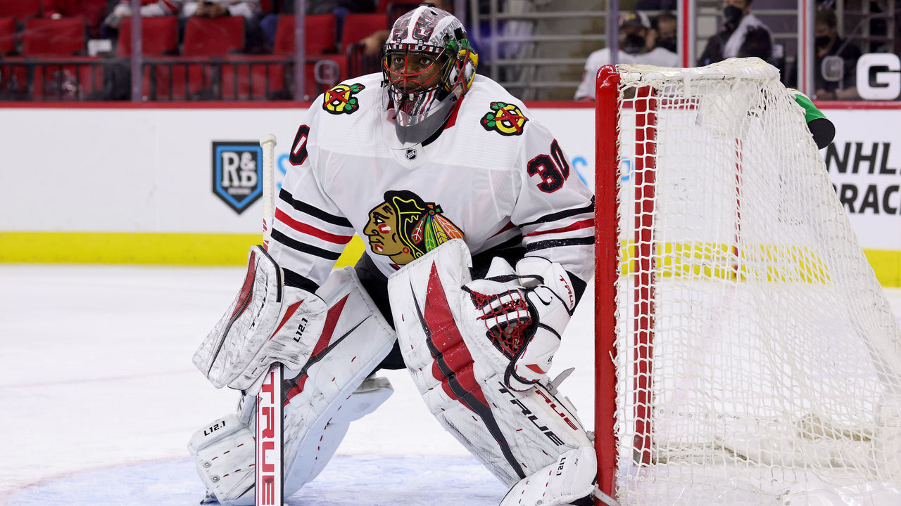 RALEIGH, NC - MAY 3: Malcolm Subban #30 of the Chicago Blackhawks crouches in the crease to protect the net during an NHL game against the Carolina Hurricanes on May 3, 2021 at PNC Arena in Raleigh, North Carolina.