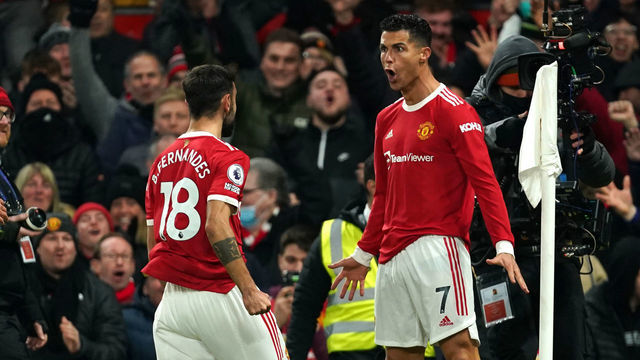 Manchester United's Cristiano Ronaldo (right) celebrates scoring their side's second goal of the game during the Premier League match at Old Trafford, Manchester. Picture date: Thursday December 2, 2021.