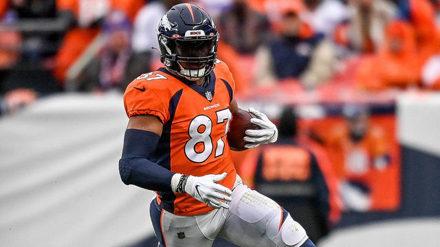 DENVER, CO - OCTOBER 31: Denver Broncos tight end Noah Fant (87) carries the ball after a reception during a game between the Denver Broncos and the Washington Football Team at Empower Field at Mile High on October 31, 2021 in Denver, Colorado.