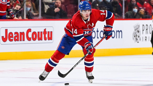 MONTREAL, QC - NOVEMBER 29: Montreal Canadiens center Nick Suzuki (14) plays the puck during the Vancouver Canucks versus the Montreal Canadiens game on November 29, 2021, at Bell Centre in Montreal, QC