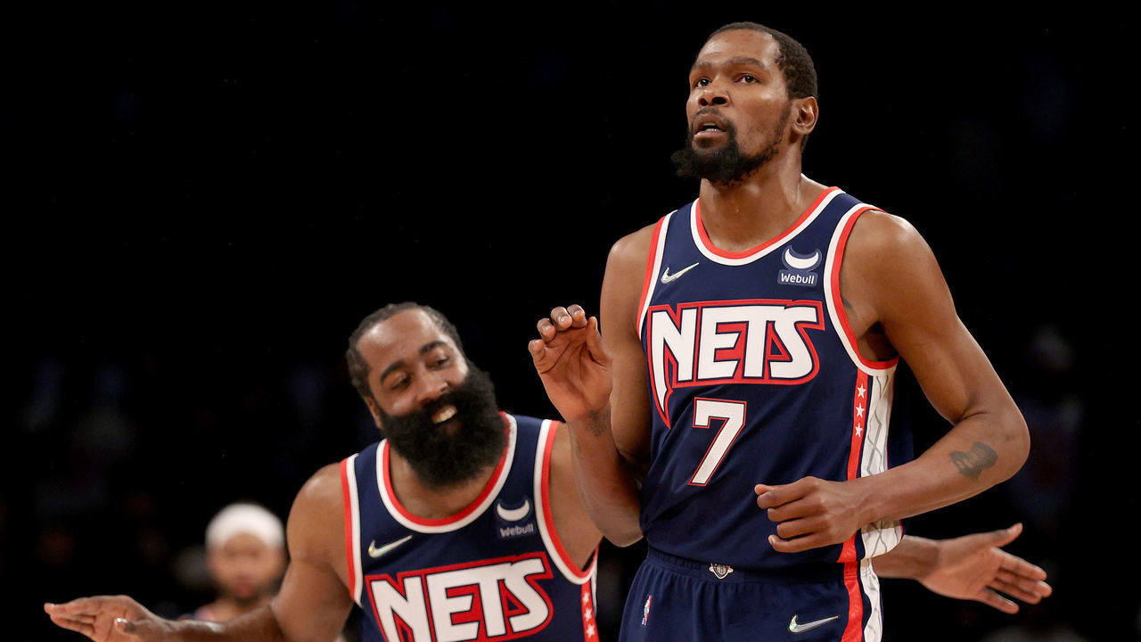 NEW YORK, NEW YORK - DECEMBER 03: James Harden #13 of the Brooklyn Nets congratulates teammate Kevin Durant #7 after Durant hit a shot to secure the lead in the final minute of the game against the Minnesota Timberwolves at Barclays Center on December 03, 2021 in the Brooklyn borough of New York City. The Brooklyn Nets defeated the Minnesota Timberwolves 110-105.