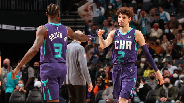 CHARLOTTE, NC - NOVEMBER 19: Terry Rozier #3 of the Charlotte Hornets high fives LaMelo Ball #2 of the Charlotte Hornets during the game against the Indiana Pacers on November 19, 2021 at Spectrum Center in Charlotte, North Carolina. Mandatory Copyright Notice: Copyright 2021 NBAE