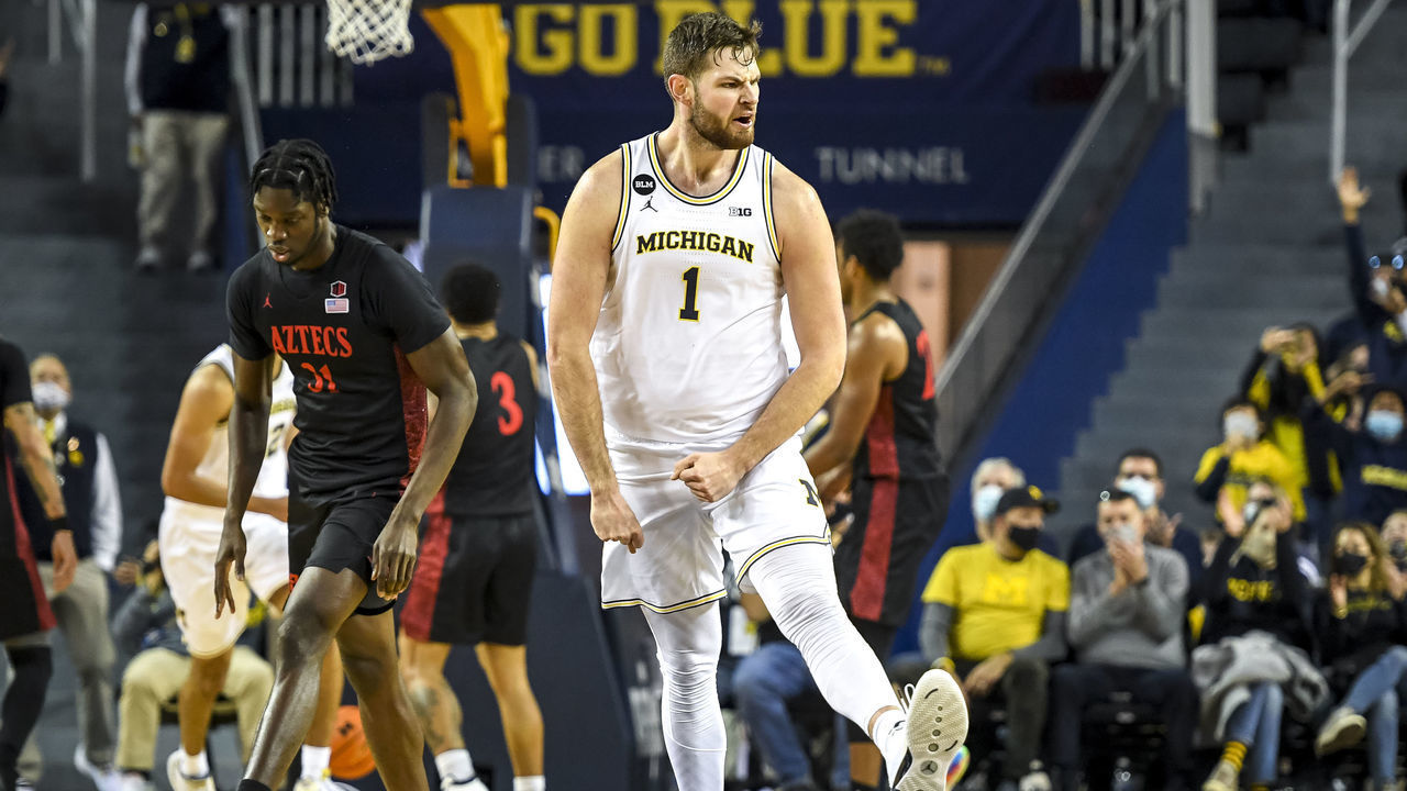 ANN ARBOR, MICHIGAN - DECEMBER 04: Hunter Dickinson #1 of the Michigan Wolverines reacts after shooting a 3-pointer against the San Diego State Aztecs during the first half at Crisler Arena on December 04, 2021 in Ann Arbor, Michigan.