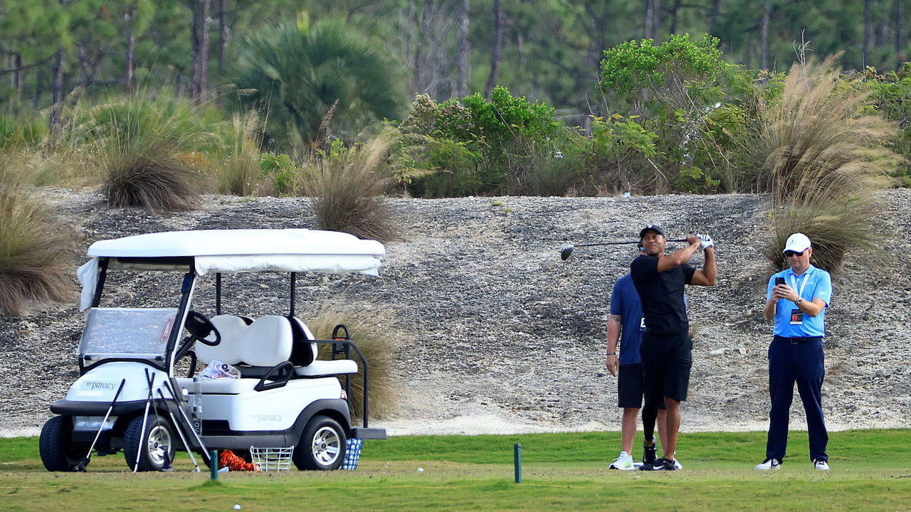 NASSAU, BAHAMAS - DECEMBER 04: Tiger Woods of the United States hits balls on the range during the third round of the Hero World Challenge at Albany Golf Course on December 04, 2021 in Nassau, .