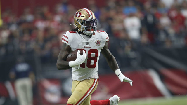GLENDALE, AZ - OCTOBER 10: Trey Sermon #28 of the San Francisco 49ers rushes during the game against the Arizona Cardinals at State Farm Stadium on October 10, 2021 in Glendale, Arizona. The Cardinals defeated the 49ers 17-10.