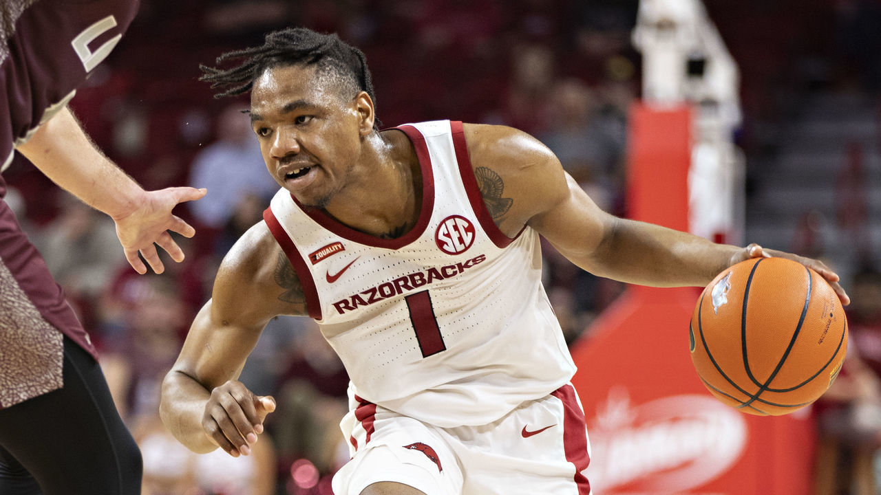FAYETTEVILLE, ARKANSAS - DECEMBER 04: JD Notae #1 of the Arkansas Razorbacks looks to drive during a game against the Little Rock Trojans at Bud Walton Arena on December 04, 2021 in Fayetteville, Arkansas. The Razorbacks defeated the Trojans 93-78.