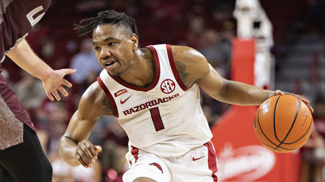 FAYETTEVILLE, ARKANSAS - DECEMBER 04: JD Notae #1 of the Arkansas Razorbacks looks to drive during a game against the Little Rock Trojans at Bud Walton Arena on December 04, 2021 in Fayetteville, Arkansas. The Razorbacks defeated the Trojans 93-78.