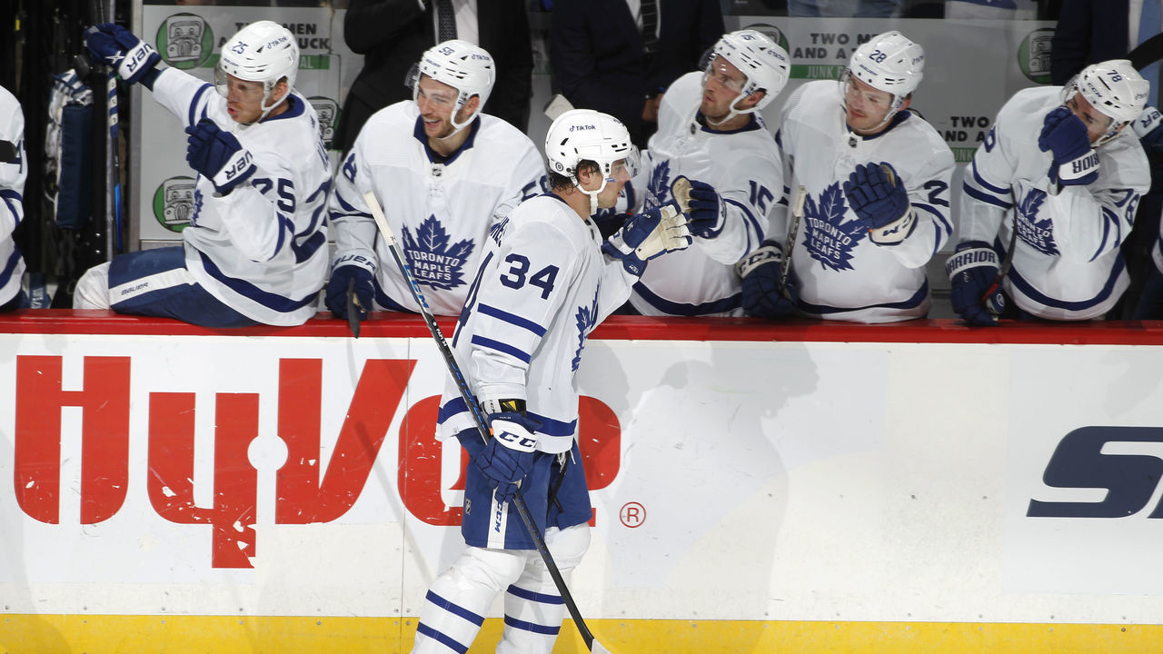 ST. PAUL, MN - DECEMBER 4: Auston Matthews #34 of the Toronto Maple Leafs celebrates with teammates after scoring a power play goal against the Minnesota Wild in the second period of the game at Xcel Energy Center on December 4, 2021 in St. Paul, Minnesota.