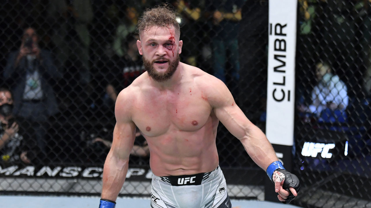 LAS VEGAS, NEVADA - DECEMBER 04: Rafael Fiziev of Kyrgyzstan reacts after his knockout victory over Brad Riddell of New Zealand in their lightweight fight during the UFC Fight Night event at UFC APEX on December 04, 2021 in Las Vegas, Nevada.