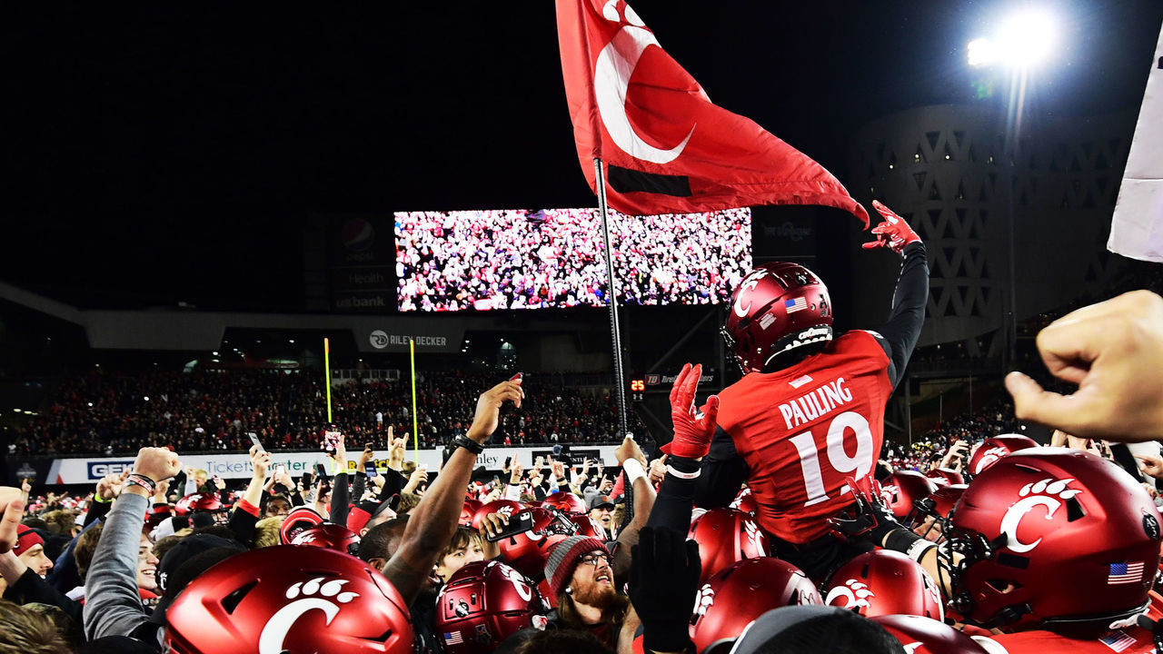 CINCINNATI, OHIO - DECEMBER 04: Will Pauling #19 of the Cincinnati Bearcats celebrates with fans after their 35-20 win over the Houston Cougars for the 2021 American Conference Championship at Nippert Stadium on December 04, 2021 in Cincinnati, Ohio.
