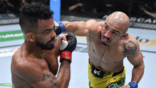 LAS VEGAS, NEVADA - DECEMBER 04: (R-L) Jose Aldo of Brazil punches Rob Font in their bantamweight fight during the UFC Fight Night event at UFC APEX on December 04, 2021 in Las Vegas, Nevada.