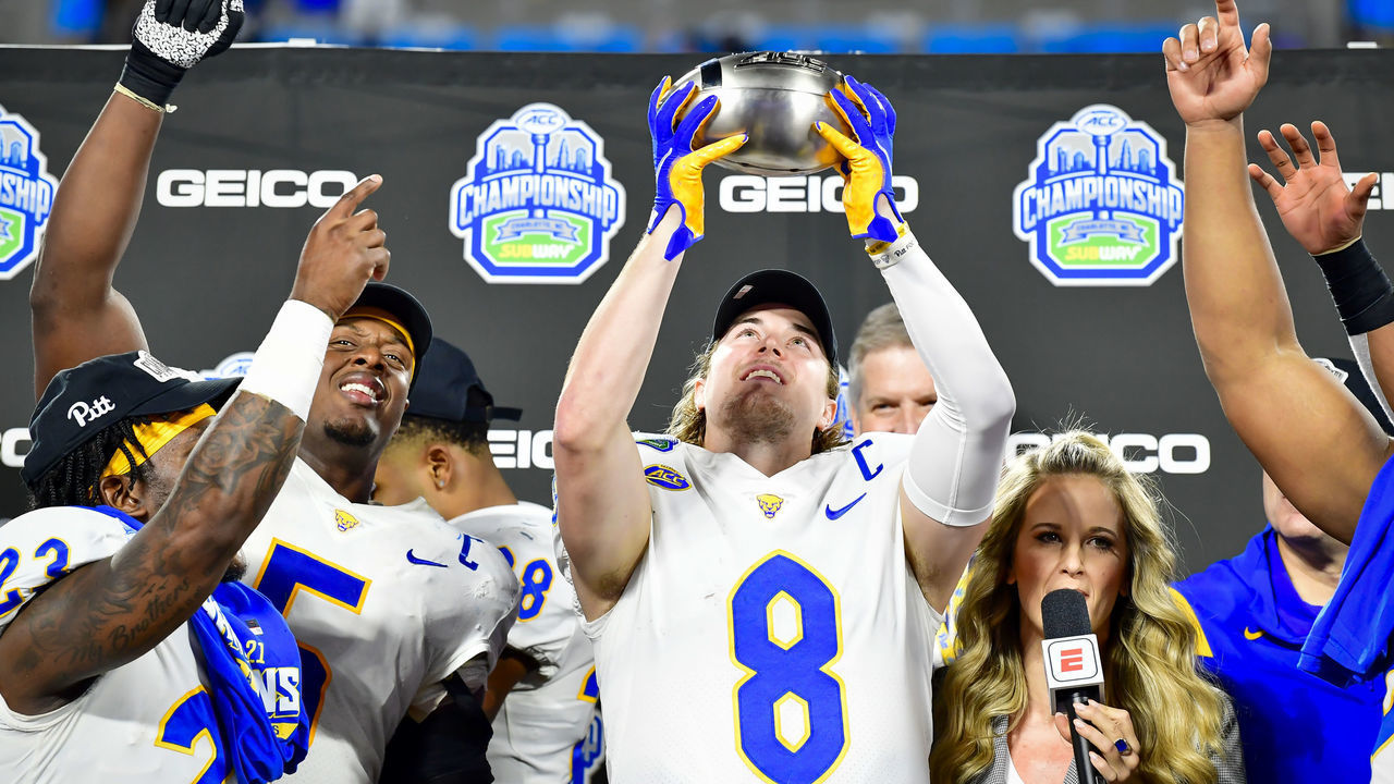 CHARLOTTE, NORTH CAROLINA - DECEMBER 04: Kenny Pickett #8 of the Pittsburgh Panthers celebrates after winning the ACC Championship game at Bank of America Stadium on December 04, 2021 in Charlotte, North Carolina.