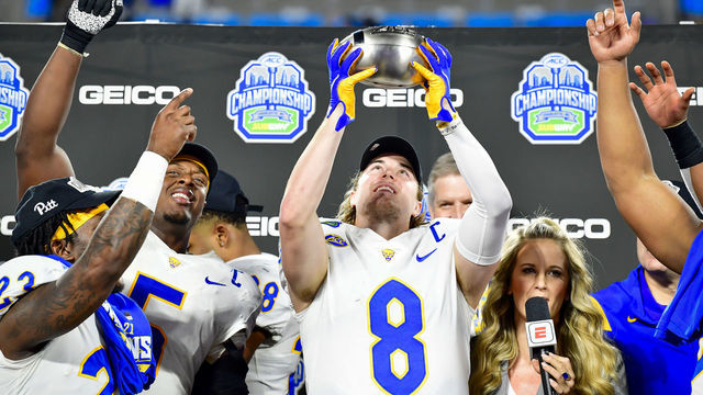 CHARLOTTE, NORTH CAROLINA - DECEMBER 04: Kenny Pickett #8 of the Pittsburgh Panthers celebrates after winning the ACC Championship game at Bank of America Stadium on December 04, 2021 in Charlotte, North Carolina.