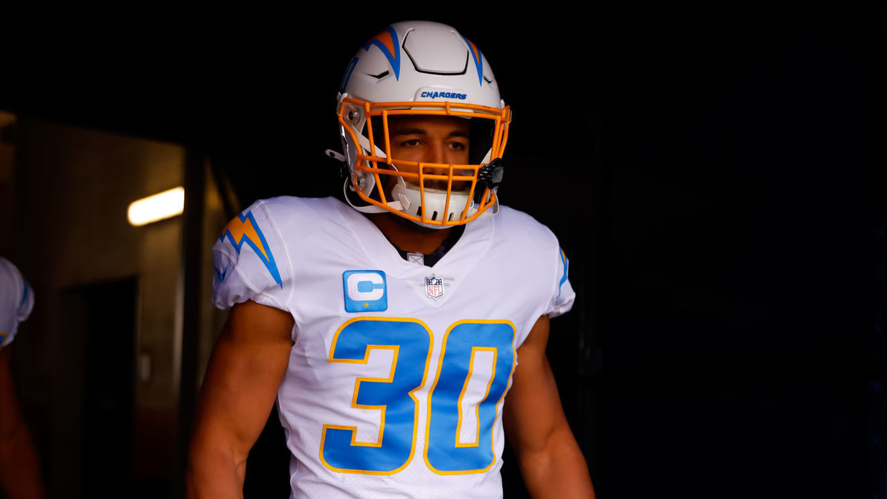 DENVER, CO - NOVEMBER 28: Running back Austin Ekeler #30 of the Los Angeles Chargers walks in the tunnel before a game against the Denver Broncos at Empower Field at Mile High on November 28, 2021 in Denver, Colorado.