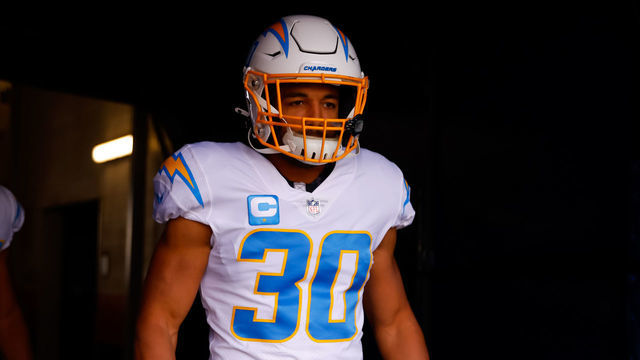DENVER, CO - NOVEMBER 28: Running back Austin Ekeler #30 of the Los Angeles Chargers walks in the tunnel before a game against the Denver Broncos at Empower Field at Mile High on November 28, 2021 in Denver, Colorado.