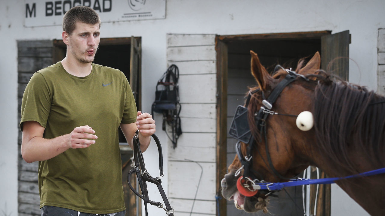 BELGRADE, SERBIA - JUNE 23: Serbian professional basketball player Nikola Jokic of the Denver Nuggets leads his horse to the stable area after the race at Beogradski hipodrom on June 23, 2019 in Belgrade, Serbia.