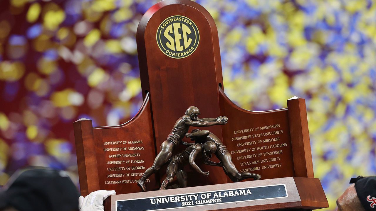 ATLANTA, GEORGIA - DECEMBER 04: The SEC Championship trophy is held after the Alabama Crimson Tide beat the Georgia Bulldogs in the SEC Championship game at Mercedes-Benz Stadium on December 04, 2021 in Atlanta, Georgia.